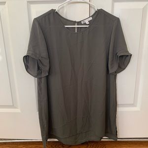 Flowy green top with ruffle sleeve